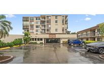 Multi-story condo building featuring private balconies, covered parking, and well maintained landscaping at 6269 Palma Del Mar S Blvd # 306, St Petersburg, FL 33715