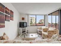Inviting living room featuring large windows, comfortable seating, and stylish decor for a cozy atmosphere at 6269 Palma Del Mar S Blvd # 306, St Petersburg, FL 33715