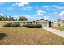 Charming one-story home with a well-maintained lawn and attached one car garage at 11698 75Th Ave, Seminole, FL 33772