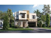 Modern two-story home featuring a mixed material facade, black window frames, and an attached two-car garage at 3919 W Leona St, Tampa, FL 33629