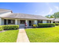 Charming single-story home with well-manicured lawn and inviting entrance at 2510 Laurelwood Dr # 5B, Clearwater, FL 33763