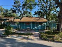 Charming single-story home with a well-manicured front yard and inviting facade at 5680 77Th N Ave, Pinellas Park, FL 33781