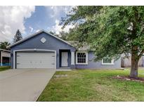 Charming one-story home featuring a spacious yard and attached two-car garage at 6145 103Rd N Ave, Pinellas Park, FL 33782