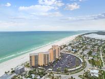 Breathtaking aerial view of the beachfront condo complex with stunning ocean views and manicured grounds at 880 Mandalay Ave # N607, Clearwater Beach, FL 33767