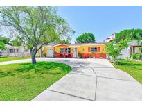 Charming single-story home with a well-manicured lawn and a spacious driveway, perfect for curb appeal at 4360 82Nd N Ave, Pinellas Park, FL 33781