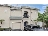 Inviting townhome with a private balcony, a garage, and stylish architecture in a desirable neighborhood at 501 Knights Run Ave # 6104, Tampa, FL 33602