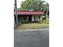 Charming single-story home featuring a red tile roof and well-maintained landscaping at 601 N Hercules Ave # 1008, Clearwater, FL 33765