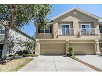 Inviting two-story townhouse with a two-car garage and dual balconies at 6736 Breezy Palm Dr, Riverview, FL 33578