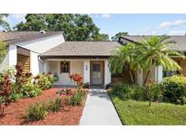 Charming single story home with a landscaped front yard and covered entryway at 7633 Piping Rock Ct # 7633, New Port Richey, FL 34654
