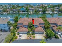 Beautiful waterfront condos with private boat docks in a lush, tropical setting at 903 Pinellas Bayway S # 103, Tierra Verde, FL 33715