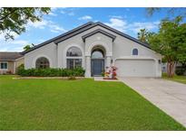 Charming single-story home with well-manicured lawn and inviting curb appeal at 1806 Powder Ridge Dr, Valrico, FL 33594