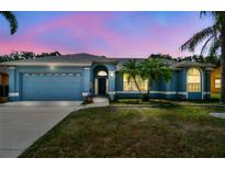 Charming single-story blue home with manicured lawn and well-maintained landscaping at 4612 35Th E Ave, Palmetto, FL 34221