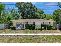Charming single-story home featuring a well-maintained front yard and a welcoming facade at 1683 Pine St, Largo, FL 33774