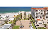 Stunning beachfront condo complex with manicured landscaping and ample parking, offering direct access to the beach at 17710 Gulf Blvd # 304, Redington Shores, FL 33708