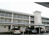 Multi-story condominium building with covered parking offering convenient access to the residences at 21103 Patio View Ct # 3302, Lutz, FL 33558