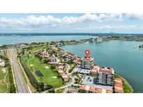 Stunning aerial view of the waterfront condo complex with access to a golf course and stunning bay views at 6322 Palma Del Mar Blvd S # 604, St Petersburg, FL 33715
