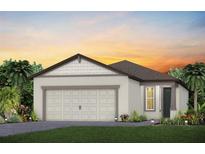 Charming single-story home featuring a two-car garage and beautifully landscaped front yard at 9542 Coastline Way, Parrish, FL 34219