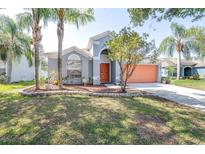 Charming single-Gathering home featuring a landscaped yard, and a two-car garage in a suburban setting at 12136 Luftburrow Ln, Hudson, FL 34669