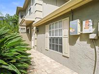 Two-story home featuring a brick walkway and well-maintained landscaping at 14134 Trouville Dr, Tampa, FL 33624