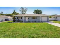 Charming single-story home with a well-maintained lawn and inviting curb appeal at 6490 22Nd S St, St Petersburg, FL 33712