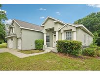 Charming home with a well-maintained lawn, attached two car garage, and an inviting front entrance at 707 9Th Sw Ave, Ruskin, FL 33570