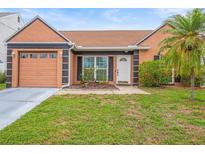 Charming single-story home with a well-maintained lawn and a cozy front entrance at 7591 121St Ter, Largo, FL 33773