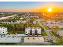 Modern townhome complex boasts contemporary design with rooftop terraces, nestled within a vibrant community at 10340 2Nd N Way, St Petersburg, FL 33716