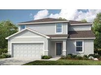 Charming two-story home with attached two car garage, neatly manicured lawn, and welcoming entryway at 13576 Tropical Breeze Way, Hudson, FL 34669