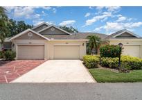 Charming villa with two car garage, mature landscaping, and inviting curb appeal at 2403 Nantucket Field Way # 27, Sun City Center, FL 33573
