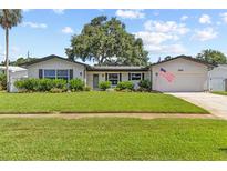 Charming single Gathering home with well-manicured lawn and beautiful landscaping at 1960 Sever Dr, Clearwater, FL 33764