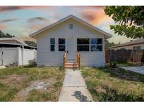 Charming white home featuring a minimalist design and cozy front entrance at 2627 17Th N Ave, St Petersburg, FL 33713