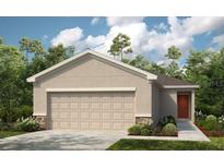 Charming single-Gathering home with a two-car garage, well-manicured lawn, and beautiful front door at 12435 Gust Ct, Hudson, FL 34669