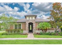 Charming single-story home with stone accents and lush landscaping at 2280 Long Spur, Odessa, FL 33556