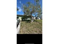 Charming single-story home with a well-manicured front yard at 10029 Brunswick Ln, Port Richey, FL 34668