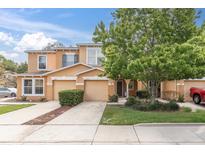 Charming townhome showcases a well-maintained lawn, lovely tree, and inviting facade at 11615 Mango Ridge Blvd # 39, Seffner, FL 33584