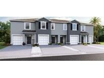 Attractive townhomes feature an attached garage and welcoming entrances, blending style with practical living at 5110 Captain Davis Dr, Wimauma, FL 33598