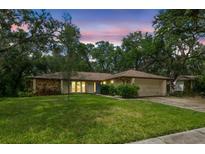 Charming single-story home with well-maintained lawn and stone accents, perfect for suburban living at 56 Bay Woods Dr, Safety Harbor, FL 34695