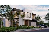 Stunning modern home featuring clean lines, large windows, and lush landscaping at 4103 W Knights Ave, Tampa, FL 33611