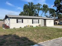 Charming single-story home features a well-kept front yard with tidy landscaping at 8665 55Th N St, Pinellas Park, FL 33782