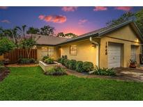 Charming single Gathering home with manicured landscaping and a one car garage at 1948 Elaine Dr, Clearwater, FL 33760