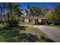 Charming single-story home with front yard, well-maintained lawn, and mature trees at 206 4Th Nw Ave, Ruskin, FL 33570