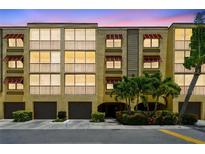 Beautiful condominium building with garage parking and mature, tropical landscaping at 5817 Park N St # 310, St Petersburg, FL 33709