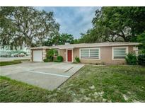 Charming single-story home with a well-maintained lawn and inviting curb appeal at 6345 Lambert Ln, New Port Richey, FL 34652