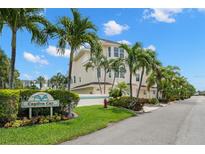 Captiva Cay offers island living with lush landscaping and vibrant tropical palm trees at 9201 Captiva Cir, St Pete Beach, FL 33706