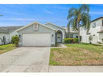 Charming single-story home featuring a well-manicured lawn and an attached two-car garage at 11222 Clayridge Dr, Tampa, FL 33635