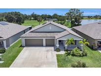 Beautiful single-story home with a three-car garage and well-maintained landscaping in a desirable neighborhood at 146 Rain Berry Ave, Ruskin, FL 33570