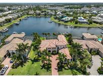 Stunning waterfront home with private boat dock and lush tropical landscaping with community lake access at 5417 Tybee Island Dr, Apollo Beach, FL 33572