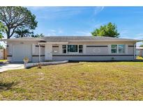 Charming single-story home with a well-maintained lawn and attached single car garage at 1732 63Rd N Ave, St Petersburg, FL 33702
