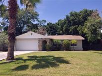 Charming single-Gathering home with a stone-accented entryway and a well-maintained lawn at 1841 Georgia Ave, Palm Harbor, FL 34683