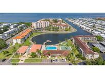 Waterfront condo community with a pool, tennis courts, and a boat dock with direct access to the bay at 19029 Us Highway 19 N # 5-14, Clearwater, FL 33764